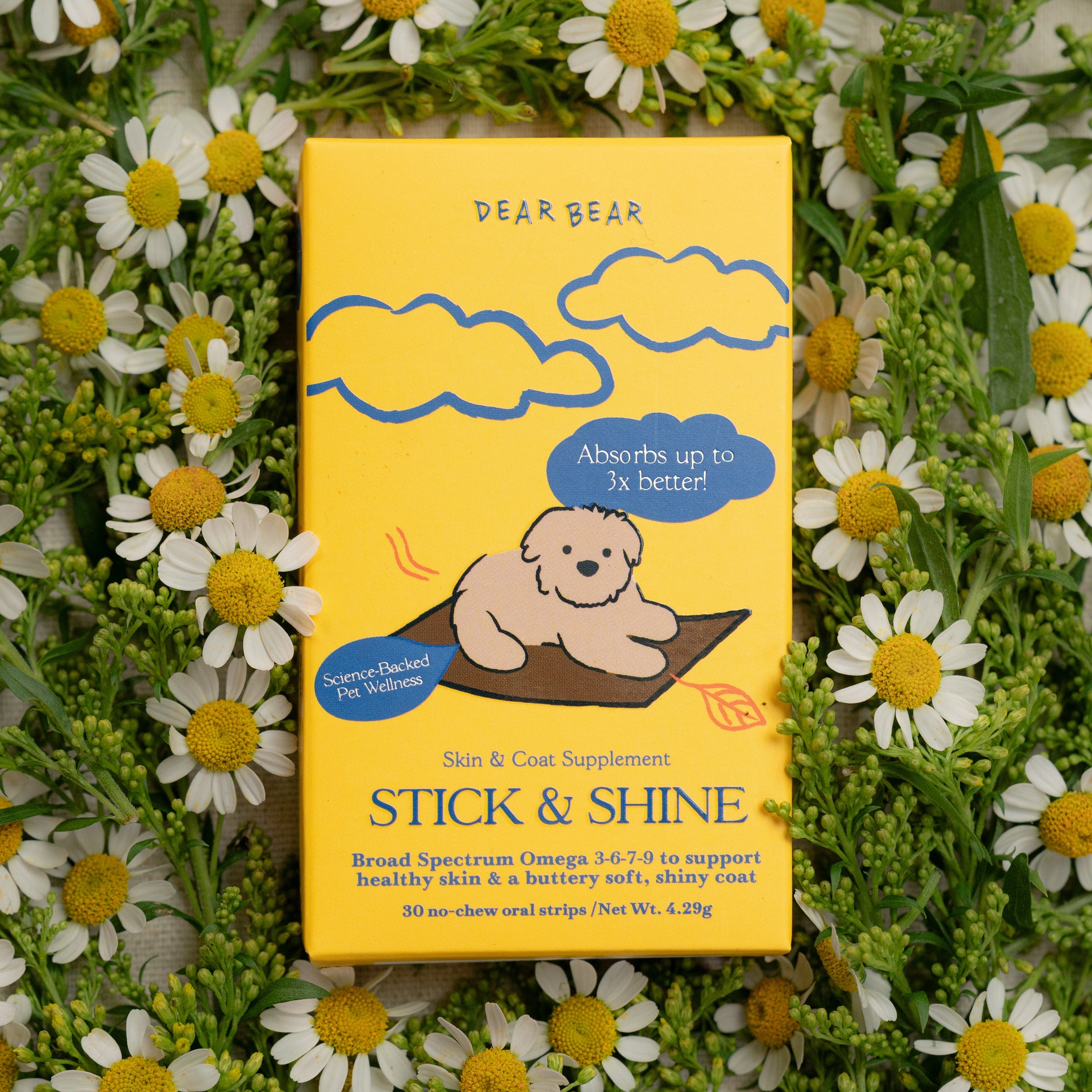 Yellow supplement package with bear illustration on a bed of flowers